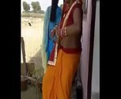 dancing aunty navel exposing from north real aunty saree navel in railway station