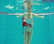 Hot Polish redhead swimming in the pool from nudist teen girls