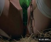 Girl is chained in a dirty basement masturbating with a bottle from erotic with bottle