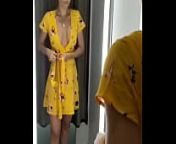Girl changes clothes in fitting room. from changing room trying on clothes at target